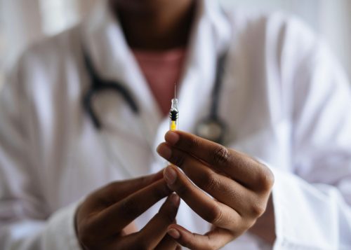 person-holding-injection-stockpack-pexels Person holding injection