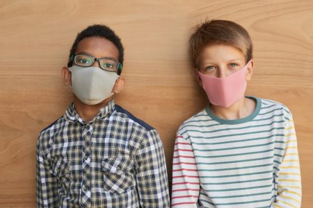 Two boys wearing face masks