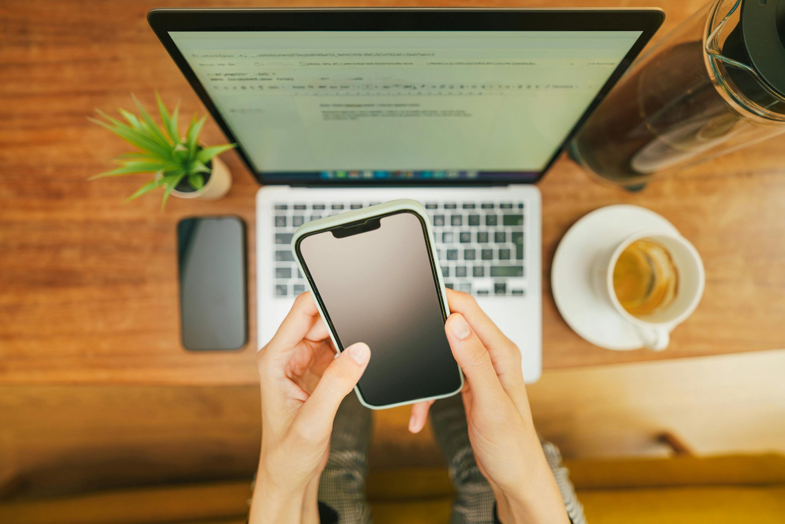 Modern workspace with smartphone and laptop